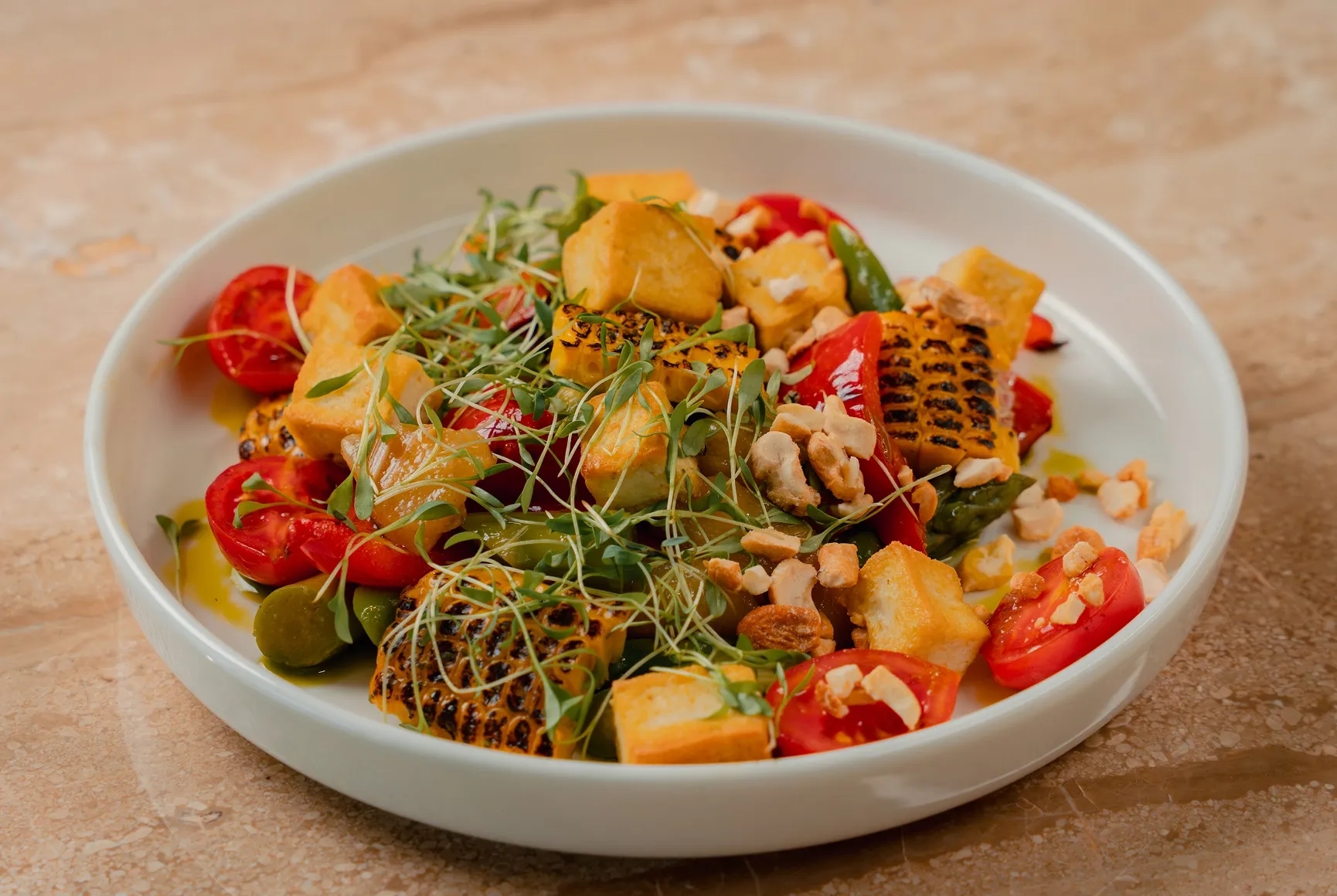 Salad with tofu, asparagus, and caramelized pear